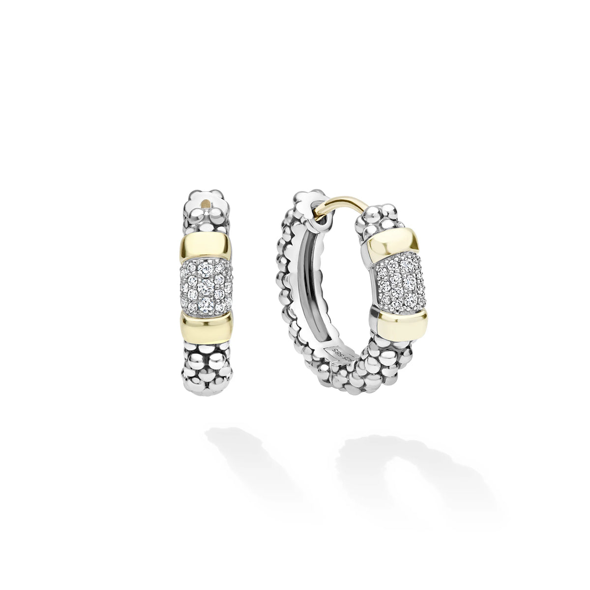 A pair of silver and yellow gold hoop earrings with pavé diamond accents, displayed on a clean white background with soft shadows.