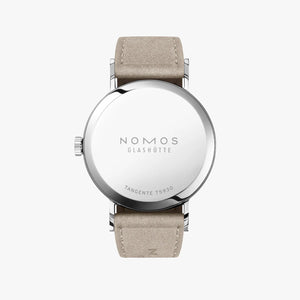 Nomos watch with beige strap on a white background