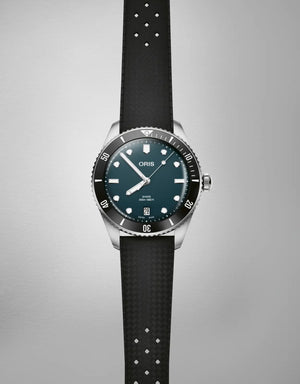 Watch with black strap and blue dial on a gray background