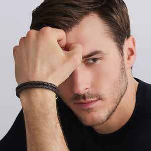 man wearing a black tshirt and a Brown Leather Braided Bracelet features two braided rows on a white background