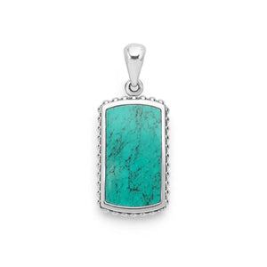 Sterling Silver and Turquoise Tag Amulet with beading around the edges on a white background