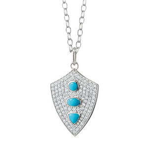 sterling silver shield necklace with white sapphires and turquoise stones on a white background