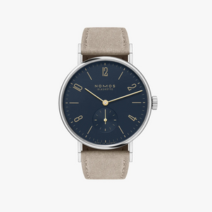 Stainless steel watch with dark blue dial, gold hands and beige strap on a white background