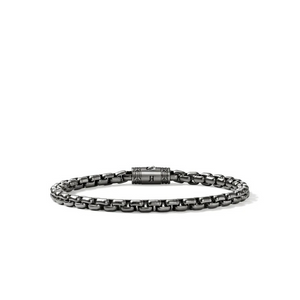 Gunmetal chain bracelet with tubular engraved clasp marked "H".
