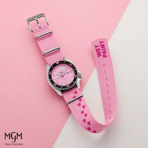 Pink watch with heart pattern strap on a pink and white background, featuring the MGM brand.