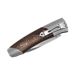 Closed folding pocket knife with copper-toned layered wood-pattern handle and stainless-steel pocket clip