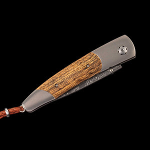 William Henry Fresh folding knife with wood handle inlay and Damascus blade, braided leather lanyard