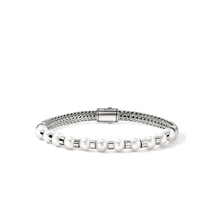 silver and pearl bracelet on a white background