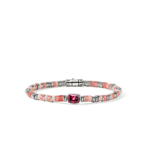 A beaded bracelet featuring textured pink and white stone beads, silver-toned spacer rings, and a central rectangular pink gemstone, displayed on a clean white background.