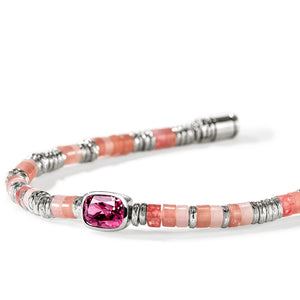 A beaded bracelet featuring pink stone beads, textured silver spacer beads, and a central cushion-cut pink gemstone in a silver bezel setting, shown on a white background.