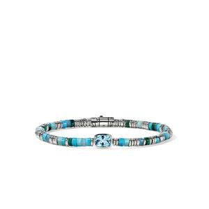 A beaded bracelet featuring turquoise and light blue beads, silver-toned spacer rings, and a central cushion-cut light blue stone, displayed on a clean white background.