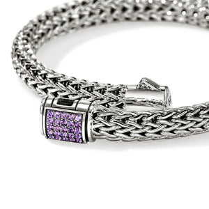 Silver bracelet with amethyst gemstones clasp on a white background