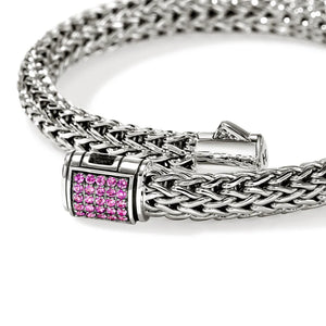 Silver chain bracelet with a pink sapphires clasp on a white background