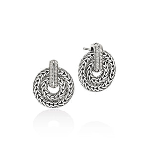 Pair of silver hoop earrings with woven design on a white background