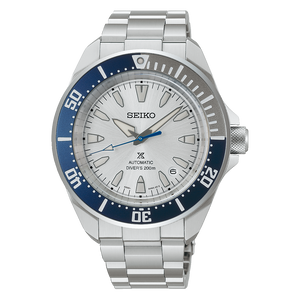 Seiko watch with silver bracelet and blue bezel on a white background