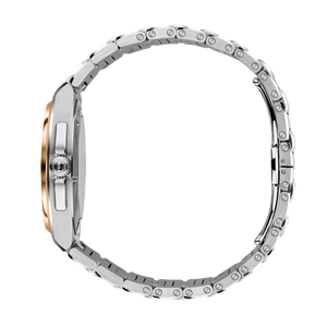 Close-up of a stainless steel watch with gold accents on a white background