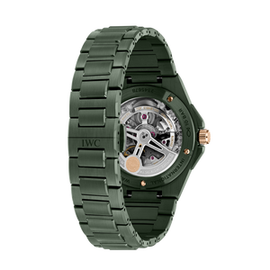 Rear three-quarter view of Ingenieur Automatic 42 green ceramic watch with IWC logo on clasp and exhibition caseback