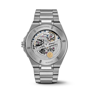 Front view of IWC Ingenieur Perpetual Calendar 41 titanium watch showcasing skeletonized dial and visible movement on white
