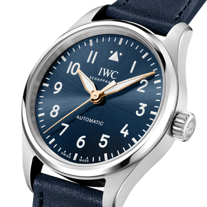 IWC watch with blue dial and blue calfskin strap on a white background