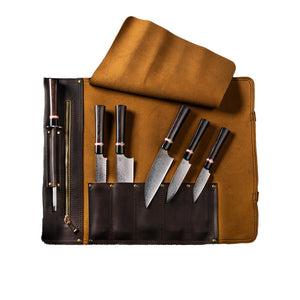 Top view of Kultro Gourmet Ebony chef set with five ebony-handled Damascus knives and sharpening steel in brown leather roll