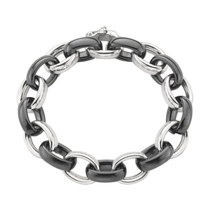 silver and black ceramic link bracelet on a white background