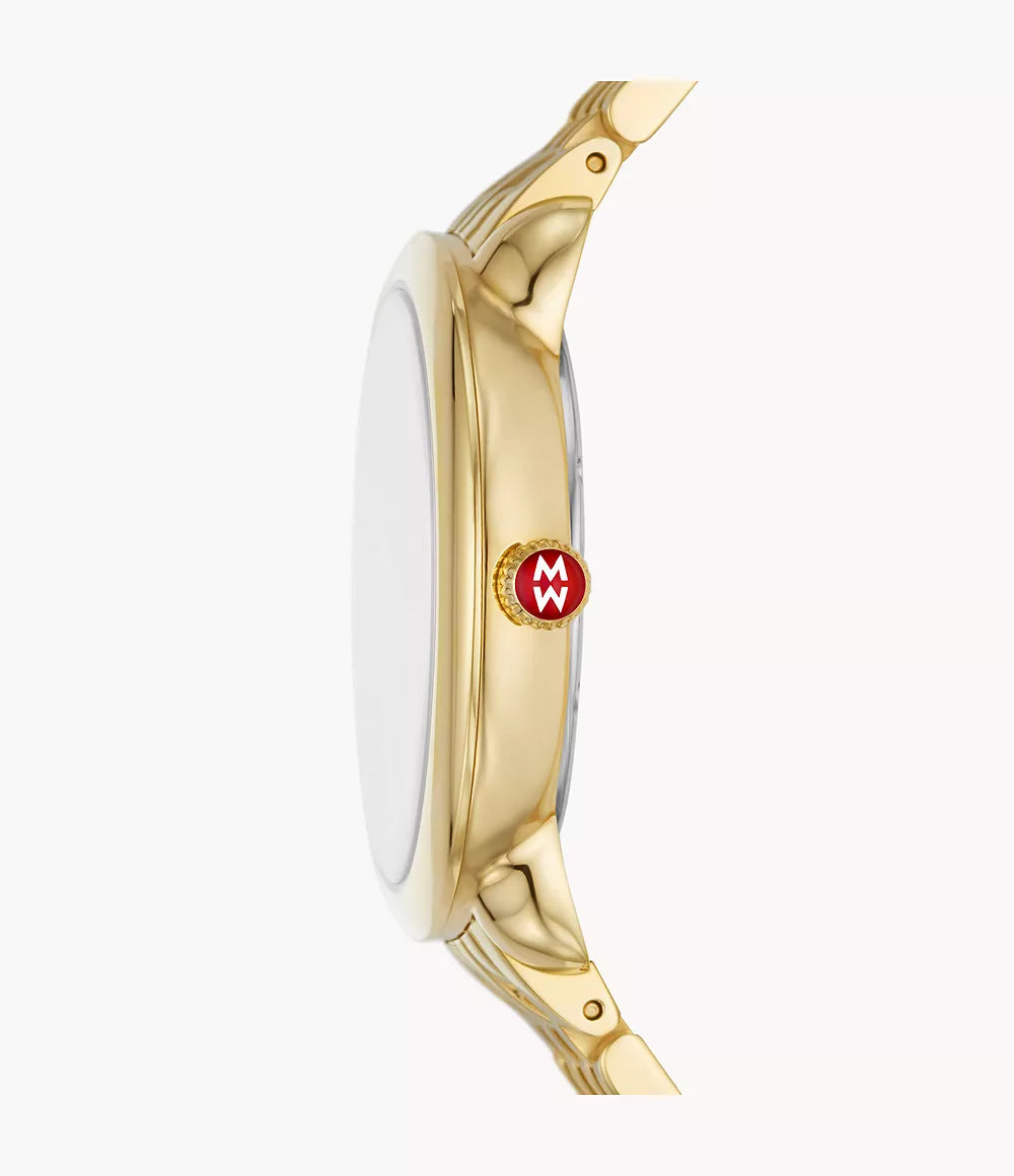 Side view of Serein Mid 18k gold-plated watch showcasing slim case, gold lugs, and red logo crown on a pale background