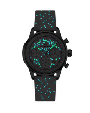 Front view of Freedom Chrono Sprinkles watch showing glowing turquoise luminescent sprinkles on gray dial and black strap