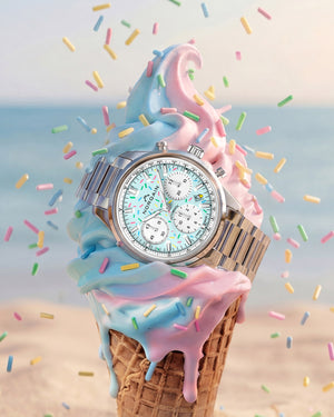 Three-quarter view of Norqain Freedom Chrono Sprinkles watch showing pastel sprinkles dial and steel bracelet on an ice cream cone