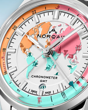Upclose Norqain timepiece with colorful face on a light blue background