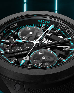 Close-up of a Norqain watch with intricate design and digital display on a dark background