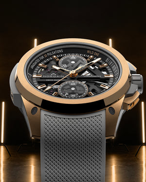 Luxury watch with a detailed face and gray strap on a dark background