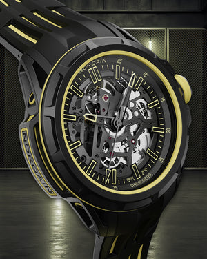 Black and yellow mechanical watch with visible brand name on a dark background