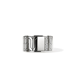 Silver ring with geometric design on a white background