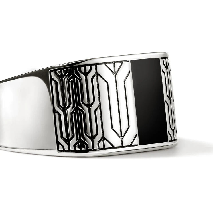 Silver bracelet with black and white pattern on a white background