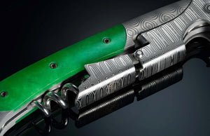 Close-up of William Henry Canopy corkscrew with Damascus steel pattern and green handle on black reflective surface