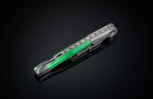 Angled view of William Henry Canopy wine opener corkscrew showcasing green handle and patterned metal on black reflective background