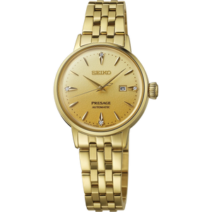 A gold-tone Seiko Presage automatic watch with a matching gold-tone metal link bracelet, shown against a plain white background.