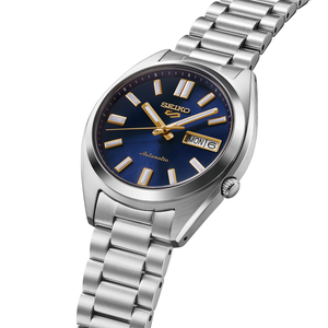 Seiko watch with silver metal bracelet and blue dial on a white background