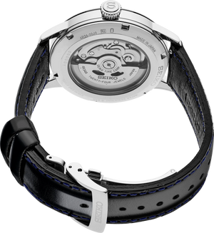 Seiko watch with navy leather strap and visible mechanical movement on a white background