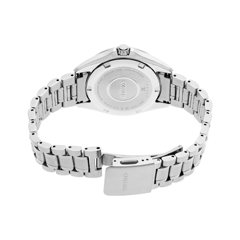 Rear view of Seiko SUR605 watch showing stainless steel bracelet, open tri-fold clasp, and engraved caseback on white background