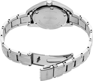 Back of a stainless steel Seiko watch on a white background