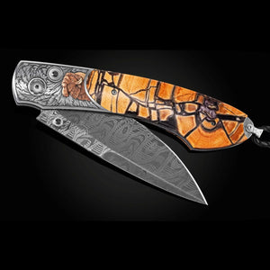 Hand-engraved pocketknife inlaid with 24K gold and copper, and fossil Mammoth tusk with black background.