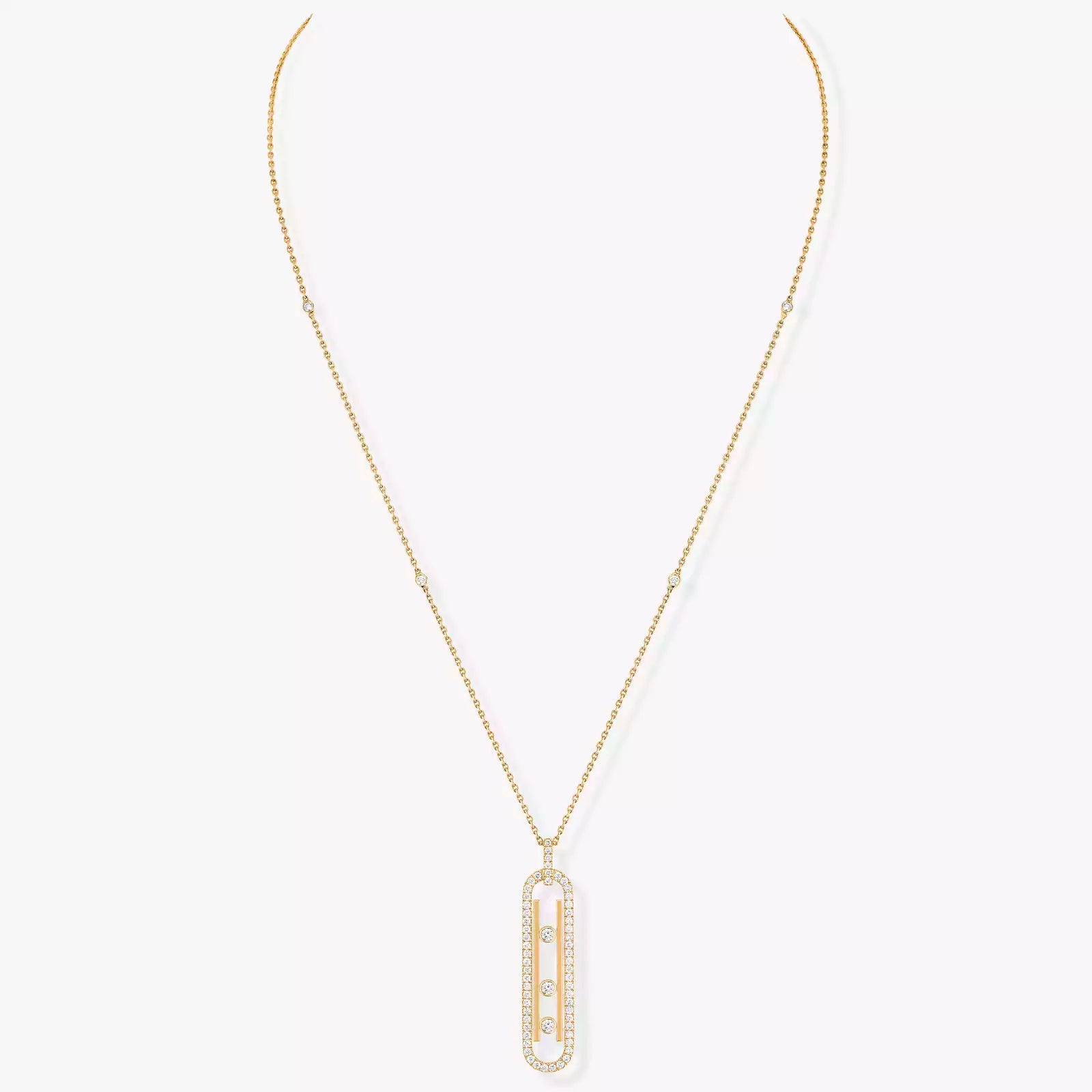 Gold necklace with a rectangular pendant on a white background