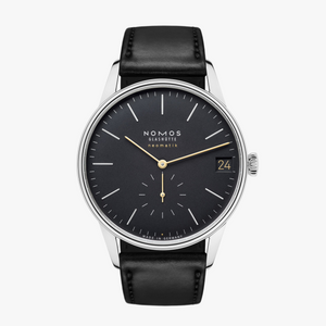 Black Orion watch face with NOMOS GLASHÜTTE neomatik logo, date 24 and MADE IN GERMANY at bottom.