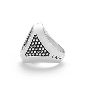 Three-quarter view of silver skull-motif signet ring showcasing beaded side panel and engraved LAGOS on white background