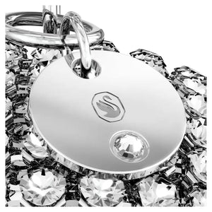 up close view crystal mesh round ornament with silver plated tag with swarovski logo suspended from a white ribbon on a white background