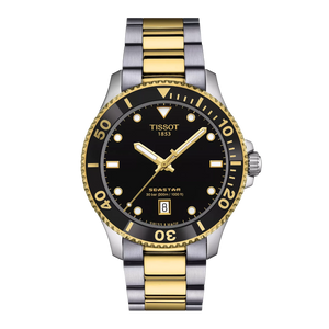 Tissot watch with black dial, gold accents, and two-tone metal strap on a white background