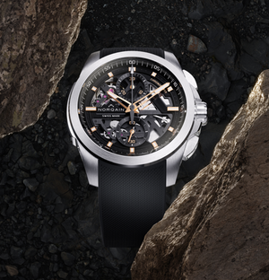 Front of NORQAIN Independence Skeleton Chrono 42mm with skeletonised dial, rose-gold hands, steel case and black rubber strap