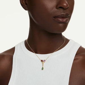 model wearing a Gold tone multicolored and mix cut stones Y necklace on a white background