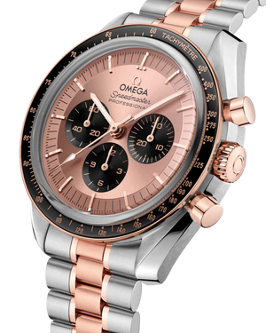 Angled view of Omega Speedmaster Moonwatch in steel and Sedna gold with pink dial, black subdials, tachymeter bezel